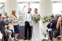 A Groom celebrates after his wedding at Rockbeare Manor