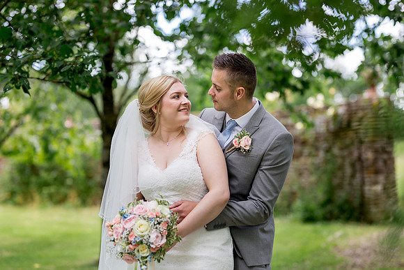 Bride and Groom portrait in the grounds of Stanton Manor near Chippenham