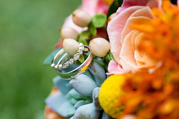 Beautiful close up of wedding rings in bridal bouquet