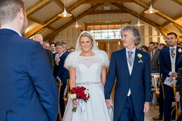 A proud father giving away his daughter at her wedding at Hyde House in the Cotswolds