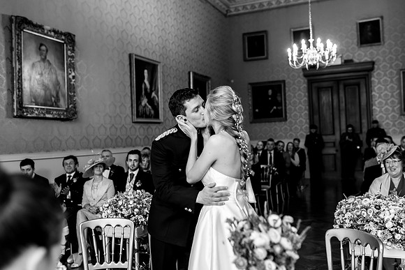 A Bride and Groom share their first kiss after their wedding at Grittleton House in Wiltshire