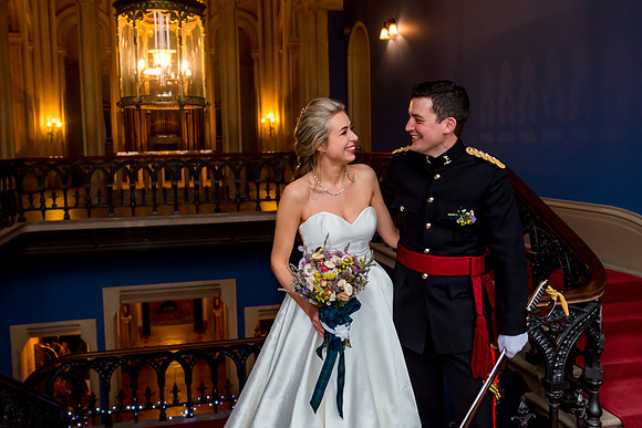 A Bride and Groom on the grand staircase at Grittleton House