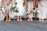 Fun wedding portrait with bride and bridesmaids feet