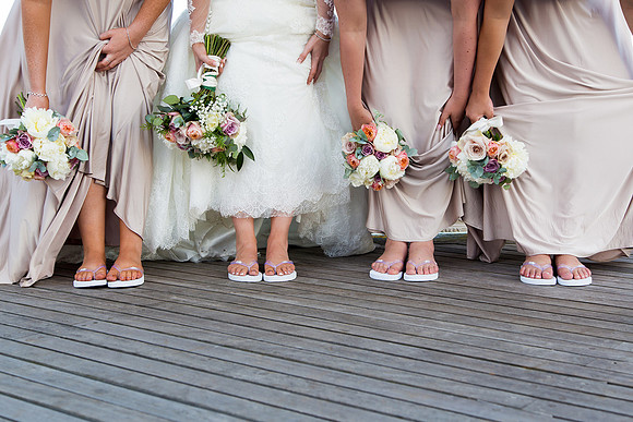 Fun wedding portrait with bride and bridesmaids feet