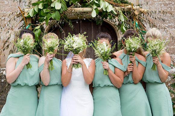 Fun wedding portrait with bride and bridesmaids